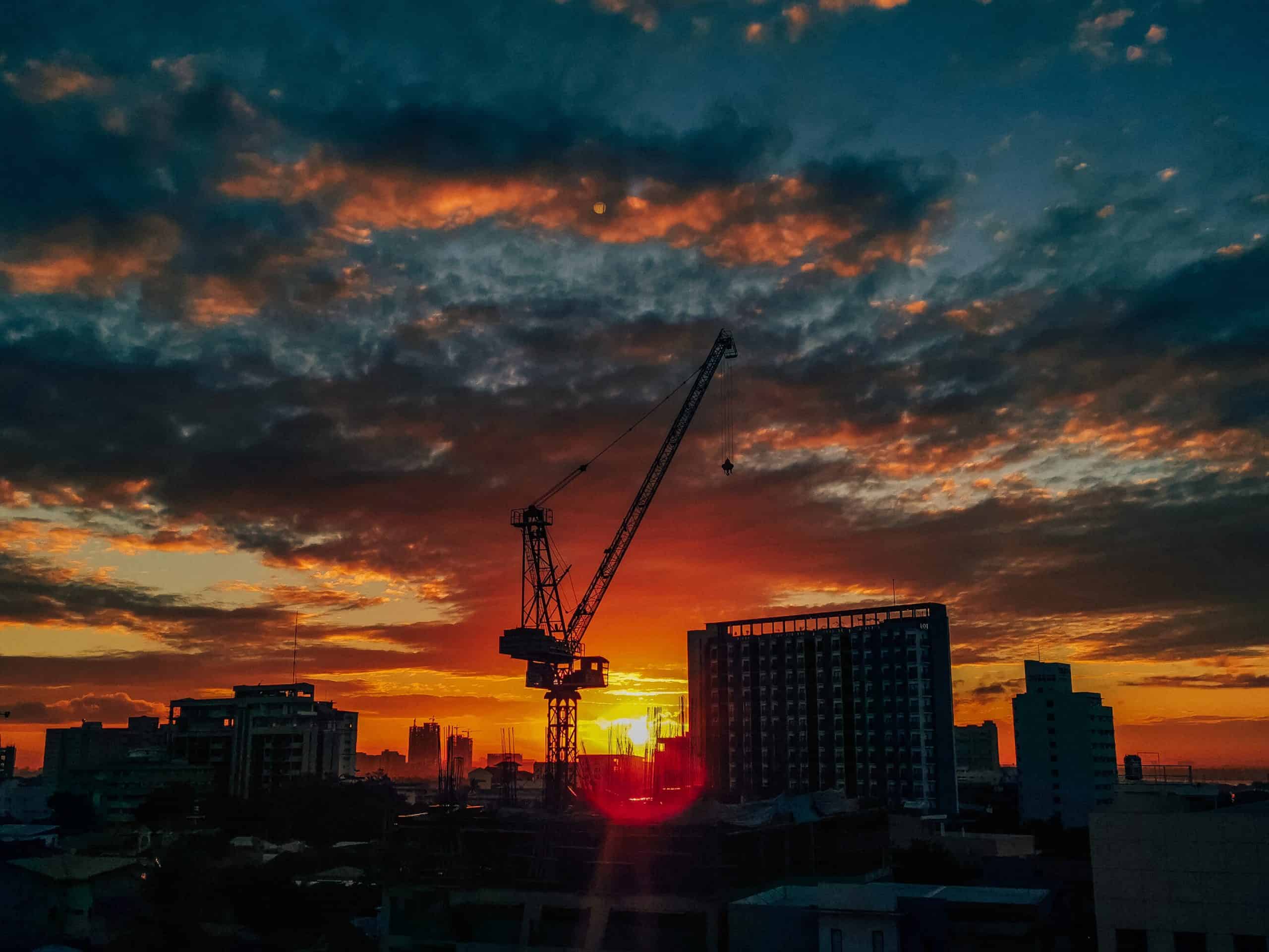 Construction site at sunrise. Payment Bond
